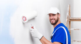 painter in white dungarees, blue t-shirt