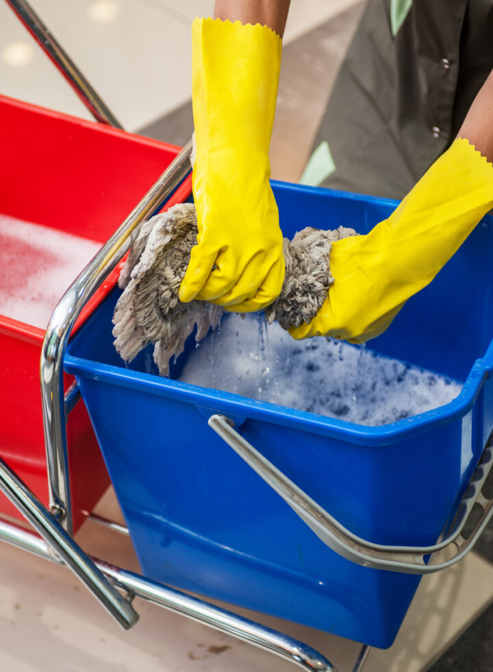 Cleaning concept. Closeup photo of woman cleaning at the office