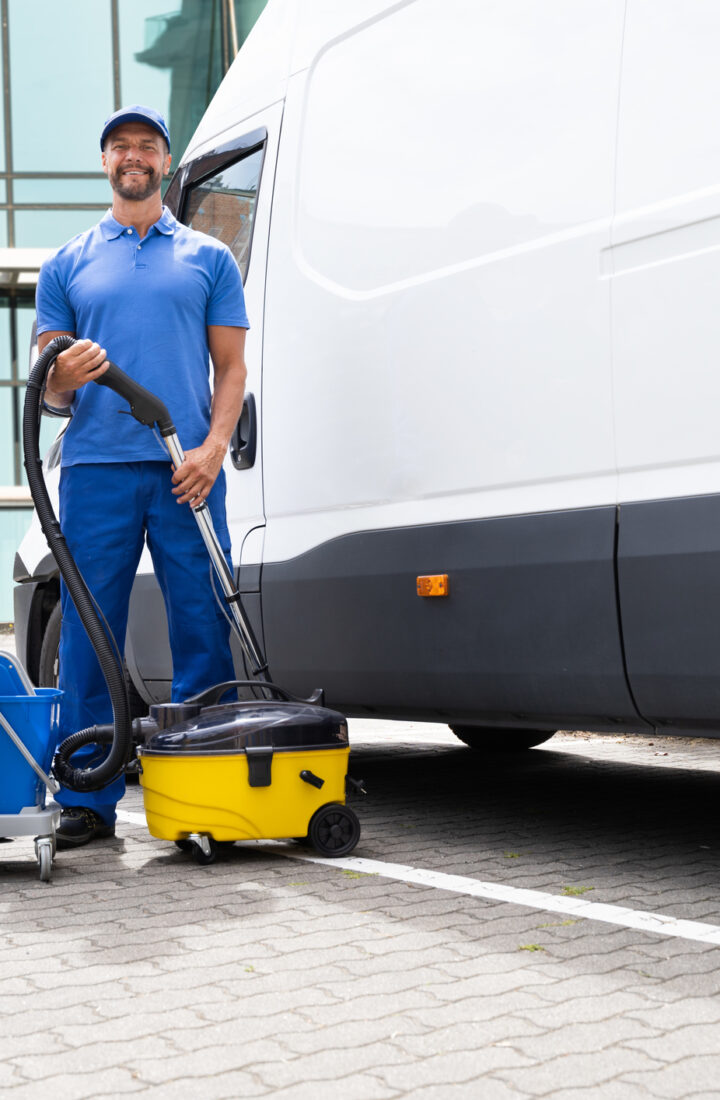 Guy With Vacuum Cleaner Guy With Vacuum Cleaner And Worker Near Truck