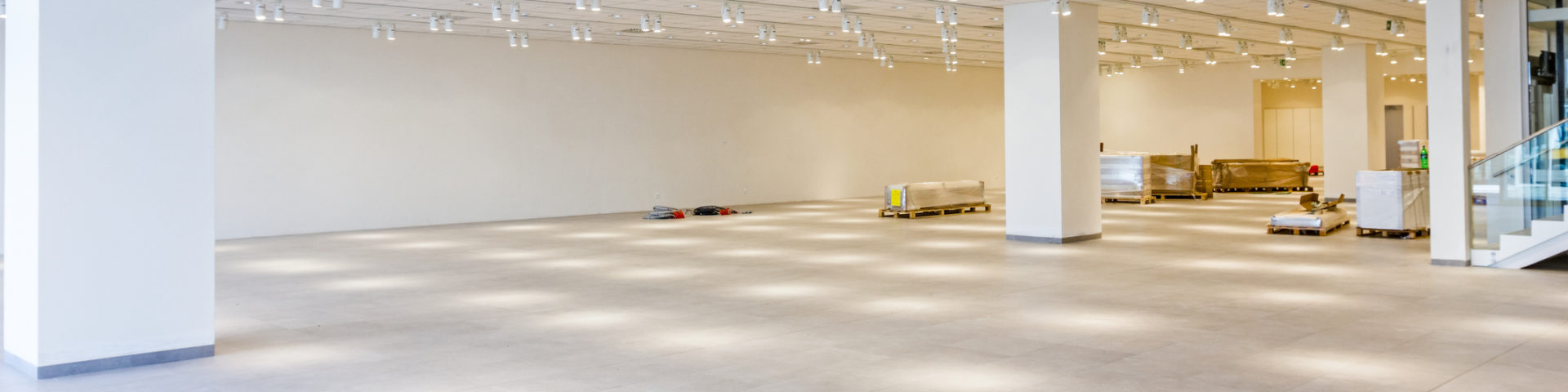 Furnishing equipment is on the floor for white room with ceiling light.