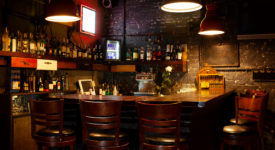Dark moody interior of modern European pub.