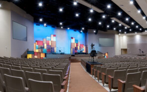 Panorama of Church Interior with Lit Stage.